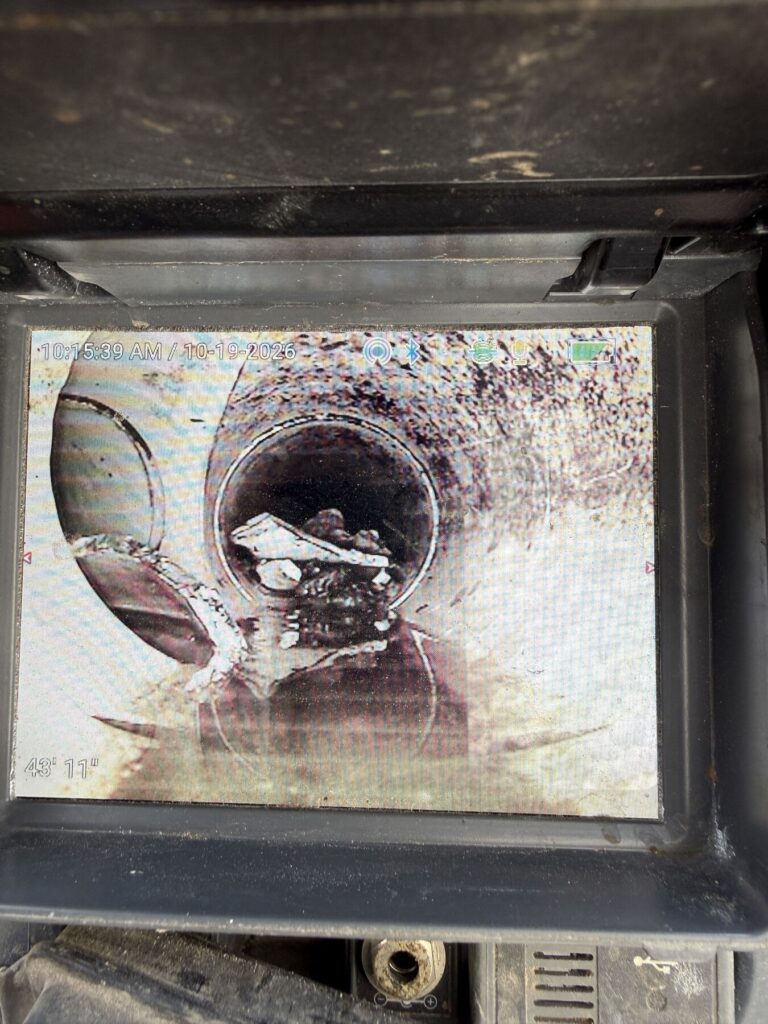 Screen displaying an inner circular opening filled with debris, timestamp reads 10:15:39 AM / 10-19-2026.